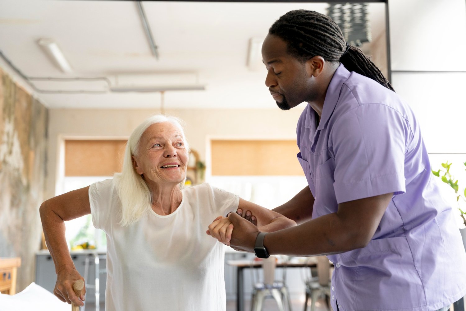 Friendly Nurse taking care of old patient