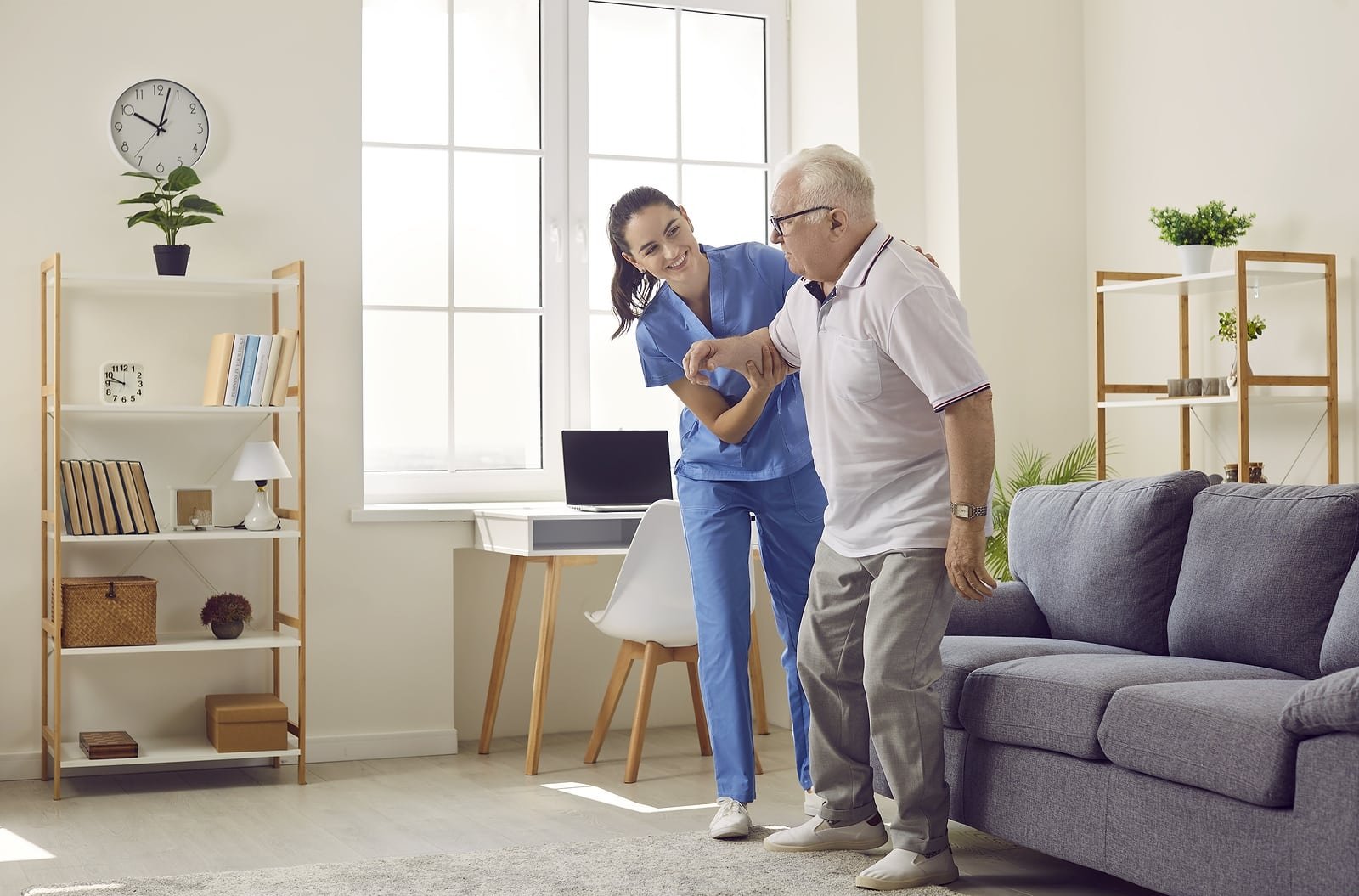Caregiver helping elderly patient
